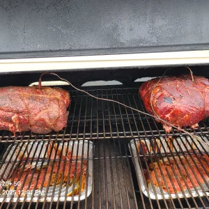 Pork butts on smoker.webp