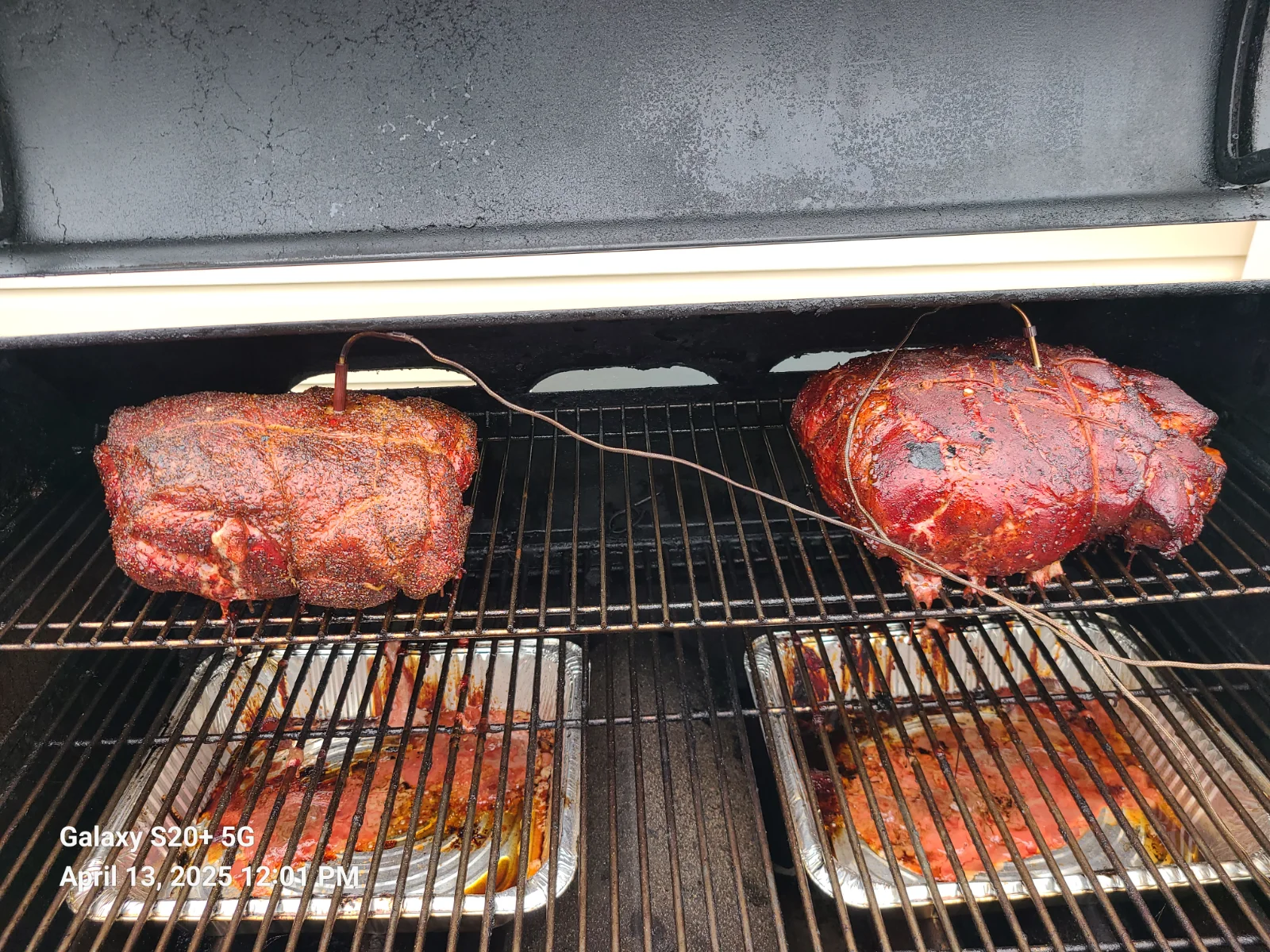 Pork butts on smoker.webp
